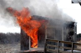 Flames Rising Out from One of the Out Buildings