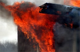 Flames Rising Out from One of the Out Buildings