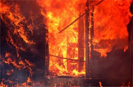 Flames Rising Out from One of the Out Buildings