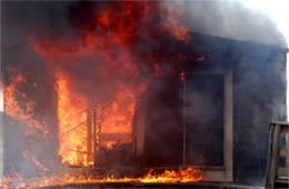 Flames Rising Out from One of the Out Buildings