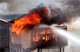 Firefighters Train at a Beach House Live Burn