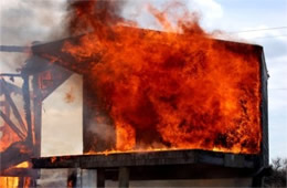 Flames Rising Out from One of the Out Buildings