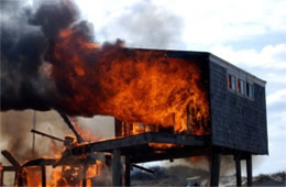 Flames Rising Out from One of the Out Buildings