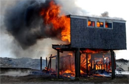 Flames Rising Out from One of the Out Buildings