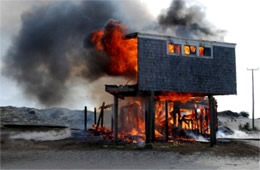 Flames Rising Out from One of the Out Buildings